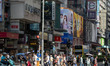 People are crossing the road in Hong Kong, on August 1, 2024. 