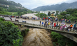 People are watching the flooded Bagmati River at Chovar in Kathmandu, Nepal, on August 6,...