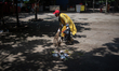 A student is cleaning a park yard in Dhaka, Bangladesh, on August 7, 2024. 