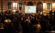People look at the film displayed on the walls of the townhall of Toulouse. The film calle...