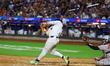 Francisco Alvarez #4 of the New York Mets is connecting for a game-winning home run to lif...