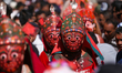 Masked dancers, depicting various gods and goddesses of Nilbarahi, perform ritualistic and...