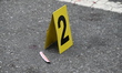 An evidence marker marks blood found at the crime scene. A 37-year-old male is shot and ki...