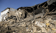 A view of the heavily damaged and partially collapsed building after the Russian missile a...