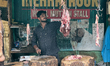 A butcher cuts meat at the Connemara market (Palayam Market) in Thiruvananthapuram, Kerala...