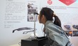 A child uses ''AR smart glasses'' during the 2024 National Science Popularization Day in B...