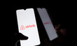 The Airbnb logo displays on a smartphone screen in Athens, Greece, on September 23, 2024....