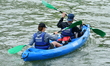 Participants in the Lyon Kayak descent race on the Saone in Lyon, France, on September 22,...