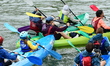 Participants in the Lyon Kayak descent race on the Saone in Lyon, France, on September 22,...