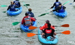 Participants in the Lyon Kayak descent race on the Saone in Lyon, France, on September 22,...
