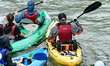 Participants in the Lyon Kayak descent race on the Saone in Lyon, France, on September 22,...