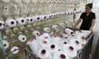 A worker produces products for export at a textile enterprise in Binzhou, China, on Septem...