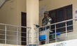 An Indian paramilitary trooper stands alert at a polling station during the second phase o...