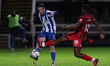 Hartlepool United's Daniel Dodds competes with Rochdale's Devante Rodney during the Vanara...