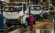 Workers work on a vehicle assembly line at a light truck workshop of Anhui Jianghuai Autom...