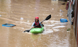 A Nepal Army personnel wades through a flooded area in search of stranded and trapped peop...