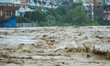 The swollen Nakkhu River inundates infrastructures built on its embankments in Lalitpur, N...