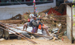 Nepal's Armed Police Force rescues stranded people using a zipline rescue method from a fl...