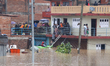 The Nepal Army conducts a rescue operation after a house is inundated by the swollen Bagma...