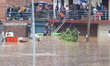 The Nepal Army conducts a rescue operation after a house is inundated by the swollen Bagma...