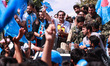 People's Conference president Sajad Gani Lone is pictured along with his workers during an...