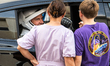 Nick Hague talks with his family from inside the car that will carry him and Alexander Gor...