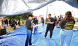 Participants set up for a protest at an international students' encampment in Brampton, Ca...