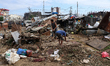 People in Imadol, Lalitpur, Nepal, salvage their damaged properties after heavy rain trigg...