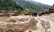 Rescue teams conduct search operations at Jhyaple Khola, Dhading District, Nepal, on Septe...