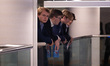 Delegates hang over a balcony at the Conservative Party Conference at the International Co...