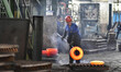 A worker works at an auto gear manufacturing company in Qingzhou Economic Development Zone...