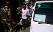 Kashmiri polling officials carry sealed Electronic Voting Machines (EVM) and Voter Verifia...