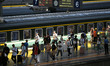 Passengers get on and off a train at Nanchang Railway Station in Nanchang, China, on Septe...