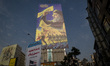 A giant banner featuring a portrait of Lebanon's Hezbollah Secretary General, Hassan Nasra...