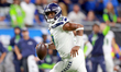 DETROIT, MICHIGAN-SEPTEMBER 30:  Quarterback Geno Smith (7) of the Seattle Seahawks runs t...