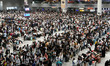 A large number of passengers wait in the waiting room of Nanchang Railway Station in Nanch...