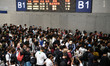 A large number of passengers wait in the waiting room of Nanchang Railway Station in Nanch...