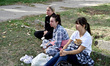 Women affected by Russian shelling are seen with their cat in Zaporizhzhia, Ukraine, on Oc...