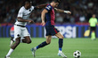 Robert Lewandowski of FC Barcelona controls the ball defended by Ebrima Colley of BSC Youn...