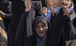 A veiled Iranian woman holds a portrait of Lebanon's Hezbollah Secretary General Hassan Na...