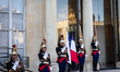 The squad of the French Republican Guard stands at the entrance of the Elysee Palace in Pa...