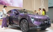 Visitors visit an AVATR 07 electric car at the 2024 China (Tianjin) International Auto Sho...