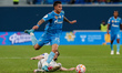 Gustavo Mantuan (C) of Zenit and Artem Kasimov of Orenburg vie for the ball during the Rus...