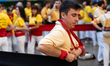 A man prepares for a human tower during the Concurs de Castells competition in Tarragona,...