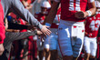 The Wisconsin Badgers walk out of the tunnel against the Purdue Boilermakers at Camp Randa...