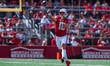 Wisconsin Badgers quarterback Braedyn Locke #18 throws a pass against the Purdue Boilermak...