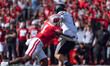 Wisconsin Badgers inside linebacker Jake Chaney #1 pressures Purdue quarterback Hudson Car...