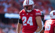 Wisconsin Badgers safety Hunter Wohler #24 celebrates a hard hit against the Purdue Boiler...