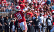 Wisconsin Badgers quarterback Braedyn Locke #18 throws a pass against the Purdue Boilermak...