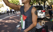 A man and his dog appear during a pro-Palestinian rally as part of an international day of...